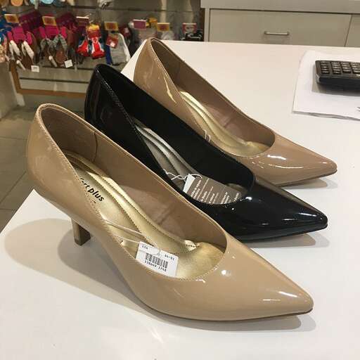a pair of shoes with a price tag