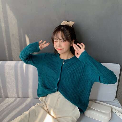 person in a teal sweater
