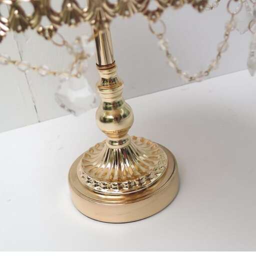 a lamp with a gold base