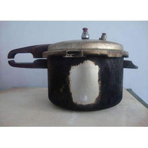 a cast iron pot with a lid and a lid.