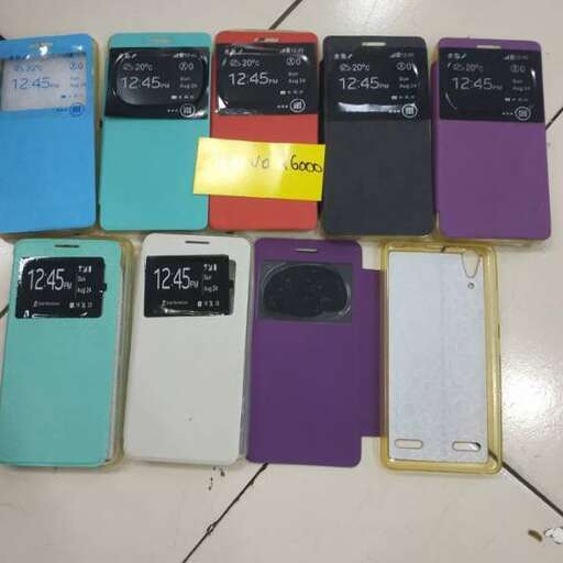 a group of cell phones sitting on top of a tile floor.