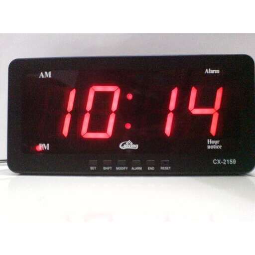 a digital clock with red numbers on it.
