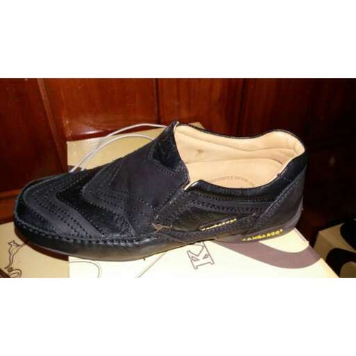 a pair of men's shoes in a shoe shop.