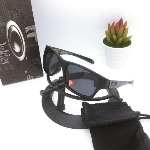 a pair of sunglasses with a flower in the background.