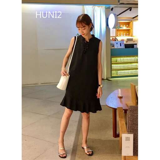 the black dress with the shoulder bag