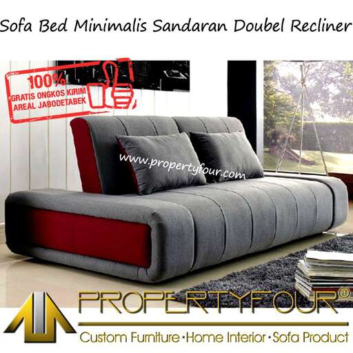 a bed with a red and grey bedding and pillows.