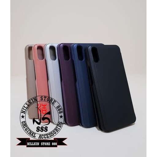 a group of cell phones are lined up in a row.
