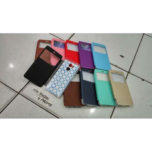 a group of colorful cell phones sitting on a tile floor.