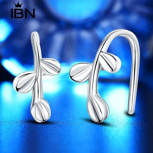 a pair of silver earrings with a butterfly wings.