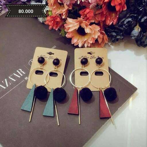 the keychain is made of wood and metal.