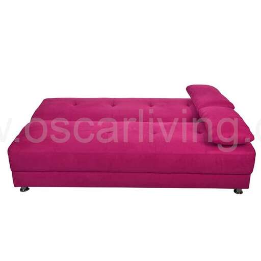the sofa is a soft pink color with a soft pink accent.