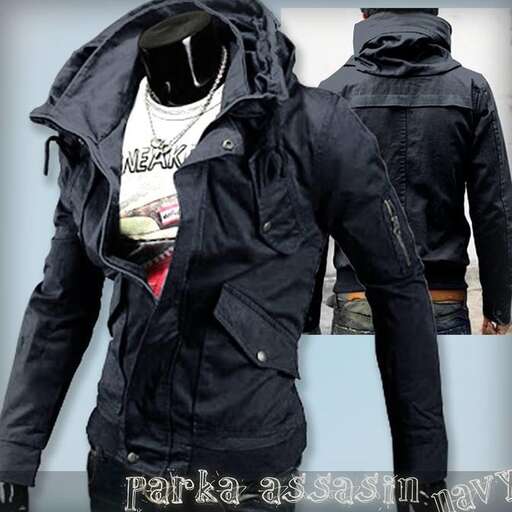 a man in a black jacket and a blue box