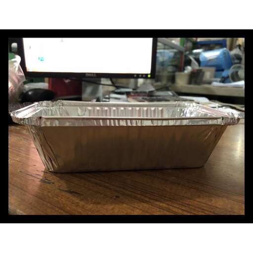 a tin with a tray of food in it.