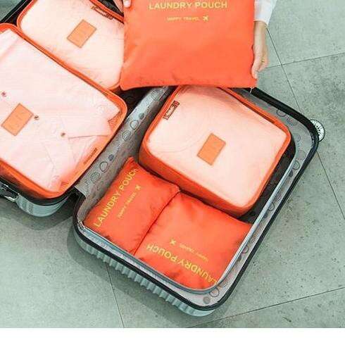 a suitcase that has some orange and white covers.