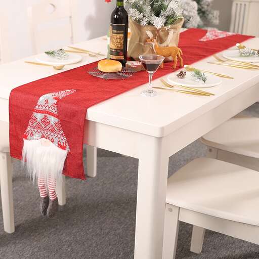 a white chair with a red and white scarf on it.