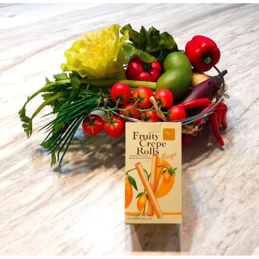 a basket of fruit and vegetables on a table.