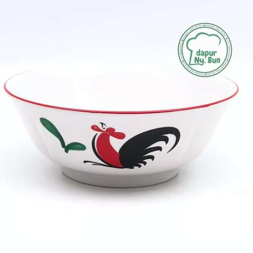 a bowl of food with a bird on it.