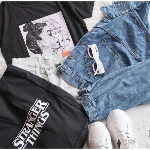 a pair of jeans with a t - shirt and a pair of sunglasses.