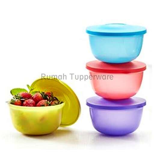 a colorful bowl with strawberries and a bowl of strawberries.