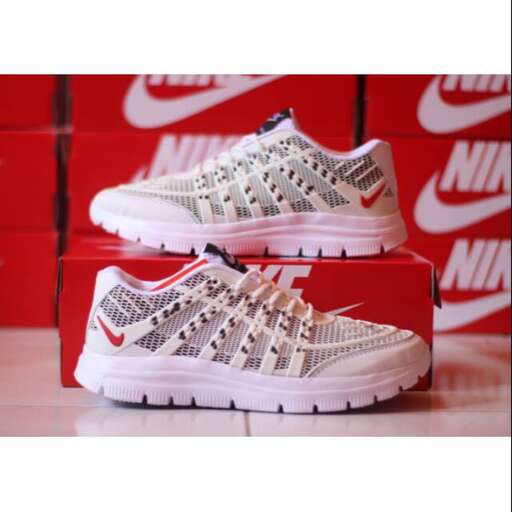 a pair of shoes in red and white.