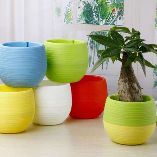 a collection of colorful bowls and vases.