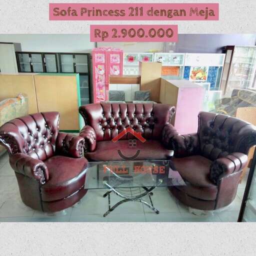 a large leather couch with a chair and a table.