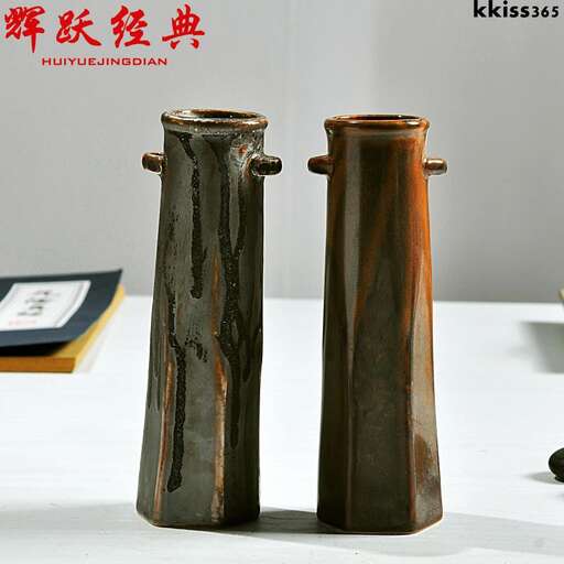 two metal containers are sitting on a table.