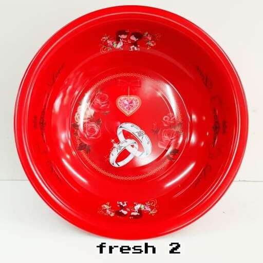 a red plate with a heart inside of it.
