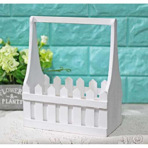a miniature picket fence made from a white picket fence.
