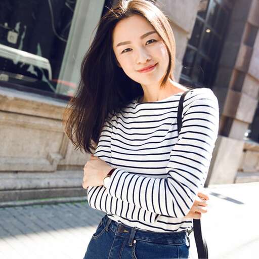 girl in striped shirt with jeans and a black and white striped shirt