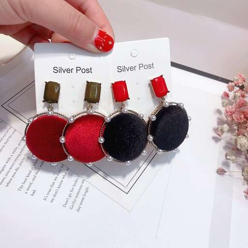 red and black felted beads in a silver plated ring.