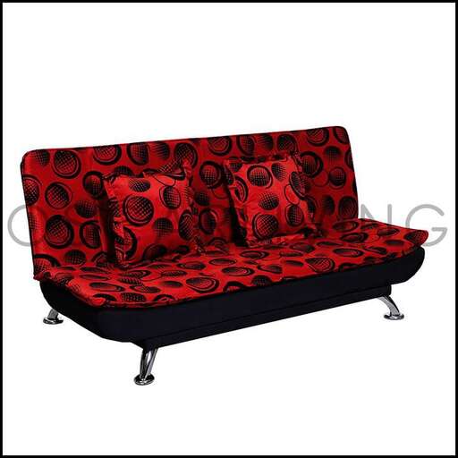 a red sofa with black dots on it.