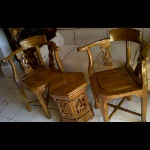 these chairs are made from a pair of wooden chairs.