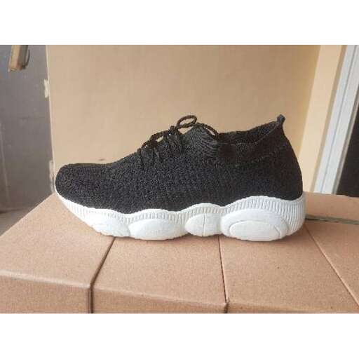 person, a new pair of running shoes