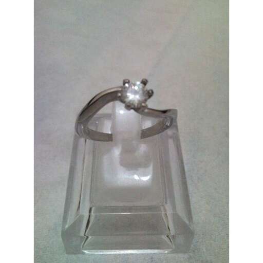 a glass candle holder with a cat in it.