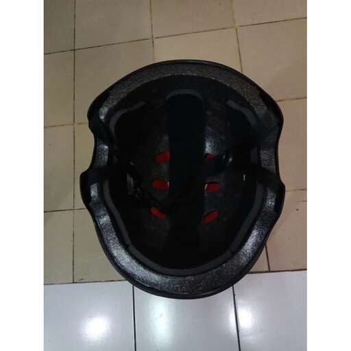 a black hole in the floor of a bathroom.