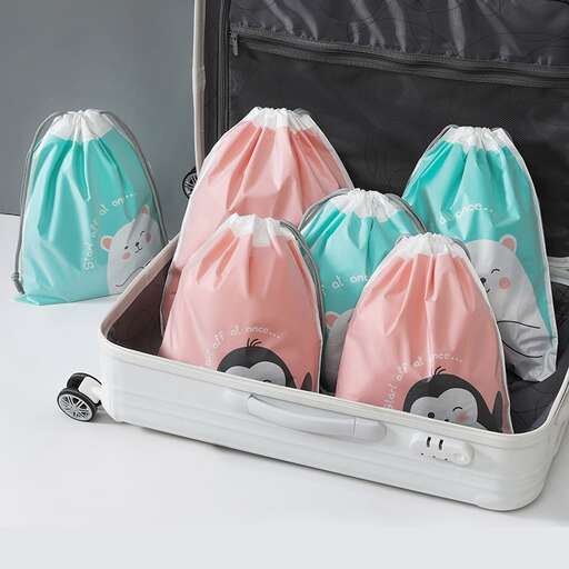 a suitcase filled with baby shoes and diapers.