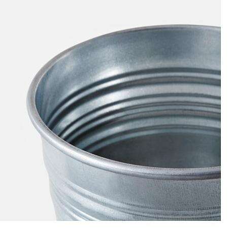 a silver bucket with a lid in it