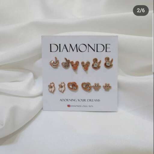 the jewellery collection is a set of 18k gold stud earrings.