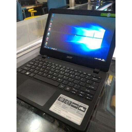 a laptop computer sitting on top of a table.