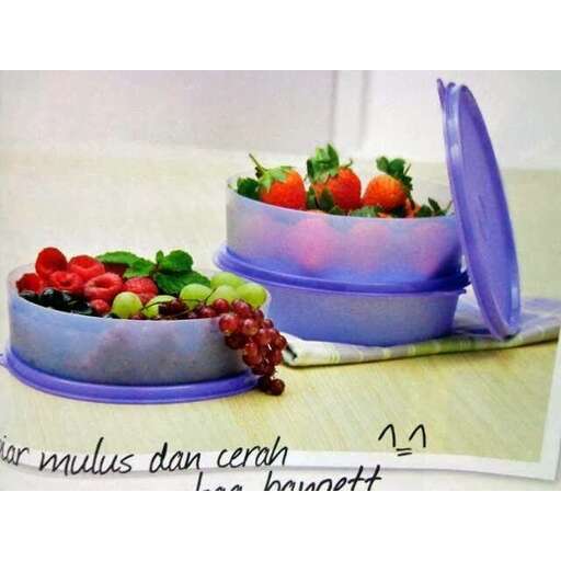 a picture of a fruit bowl with a spoon in it.