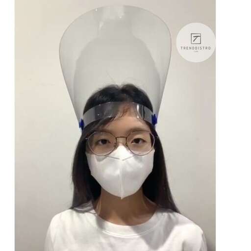 a girl wearing a mask and glasses.