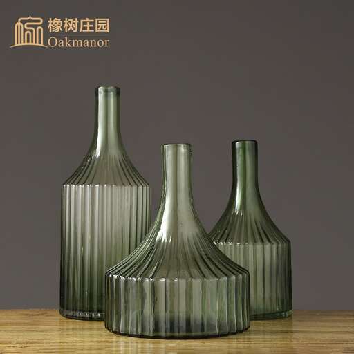a set of three wine bottles.