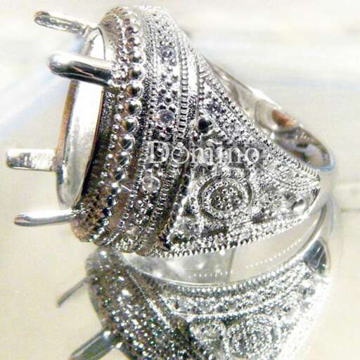 a beautiful silver bracelet with a flower design in the middle.