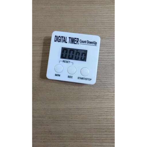 digital clock with digital numbers on a table