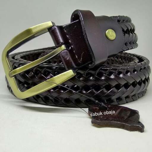 a leather belt with a yellow button.