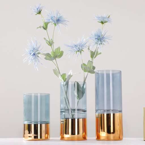 a group of vases with flowers in them.