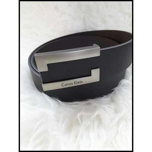 a black leather bracelet with a silver buckle.