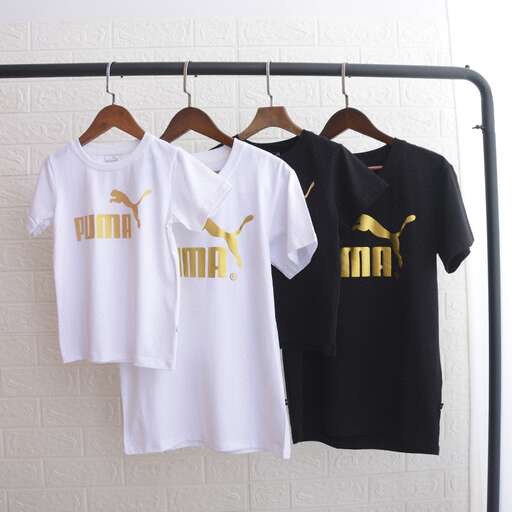 a couple of t - shirts hanging on a clothes line.