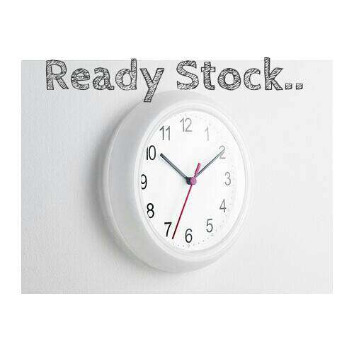 a clock with a white face and a black and red clock.